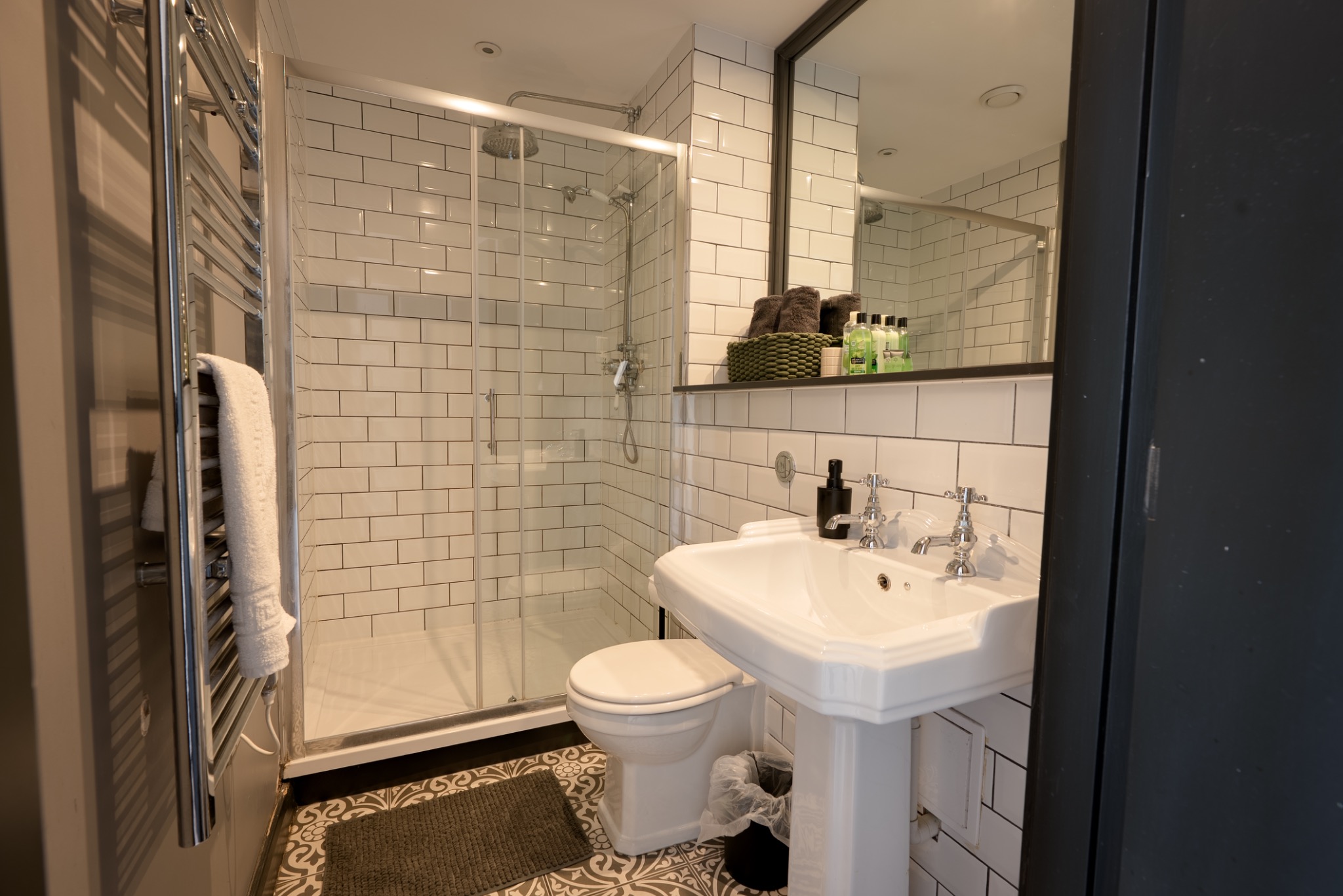 Tiled bathroom with walk-in shower
