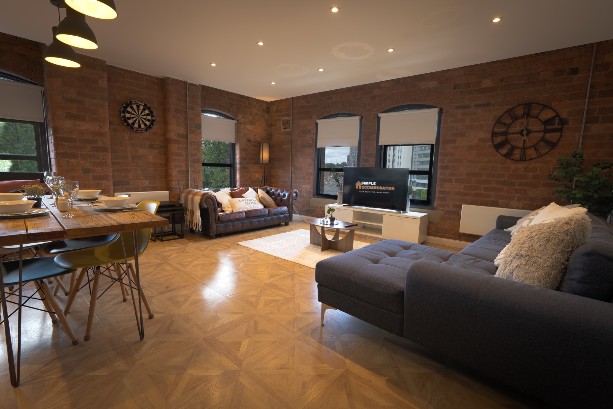 Spacious living room with exposed brick